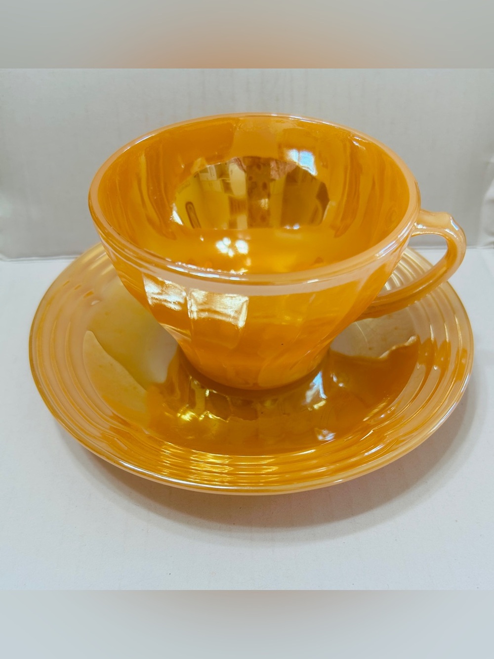 Vintage cup & saucer, peach lustre Fire King Anchor Hocking. Mint condition!